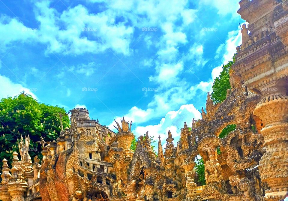 "Whimsical Stone Dreams
This photo showcases an intricately designed architectural structure with ornate sculptural details. The forms and patterns appear organic and whimsical, creating a unique and artistic atmosphere.