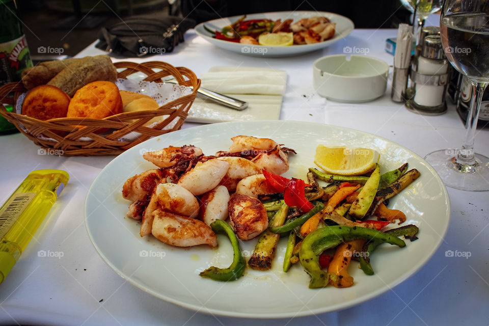 Grilled squid, bread and vegetables