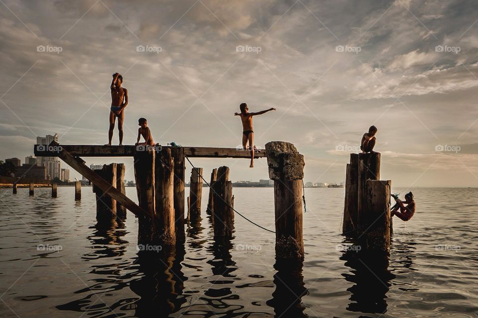 kids on a pier