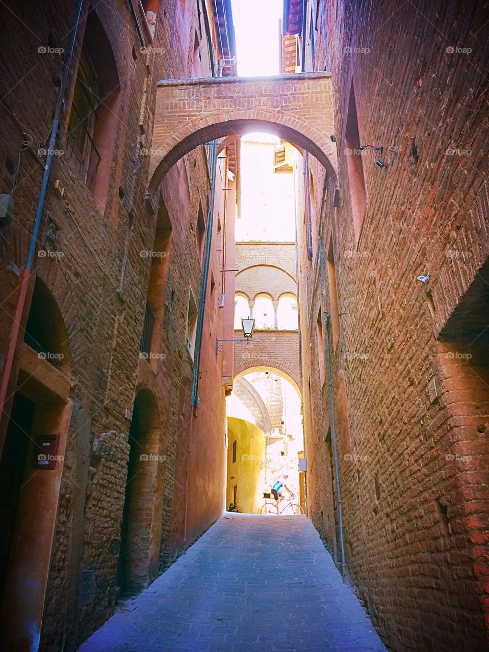 Siena alleyway with biker