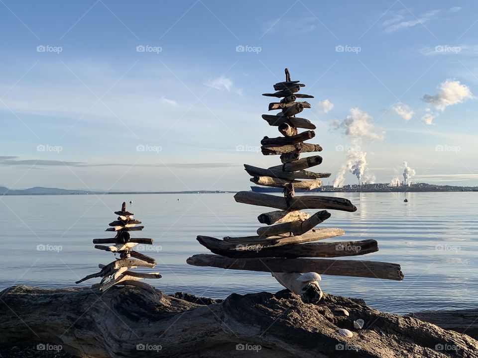 Beach Christmas trees with refinery