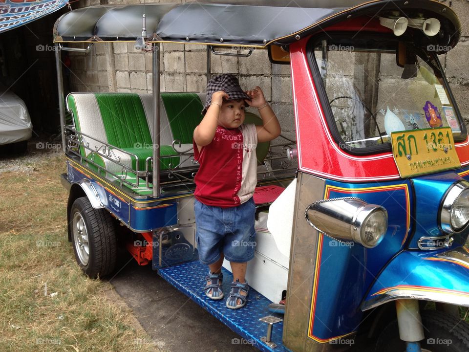 Boy in tuk tuk