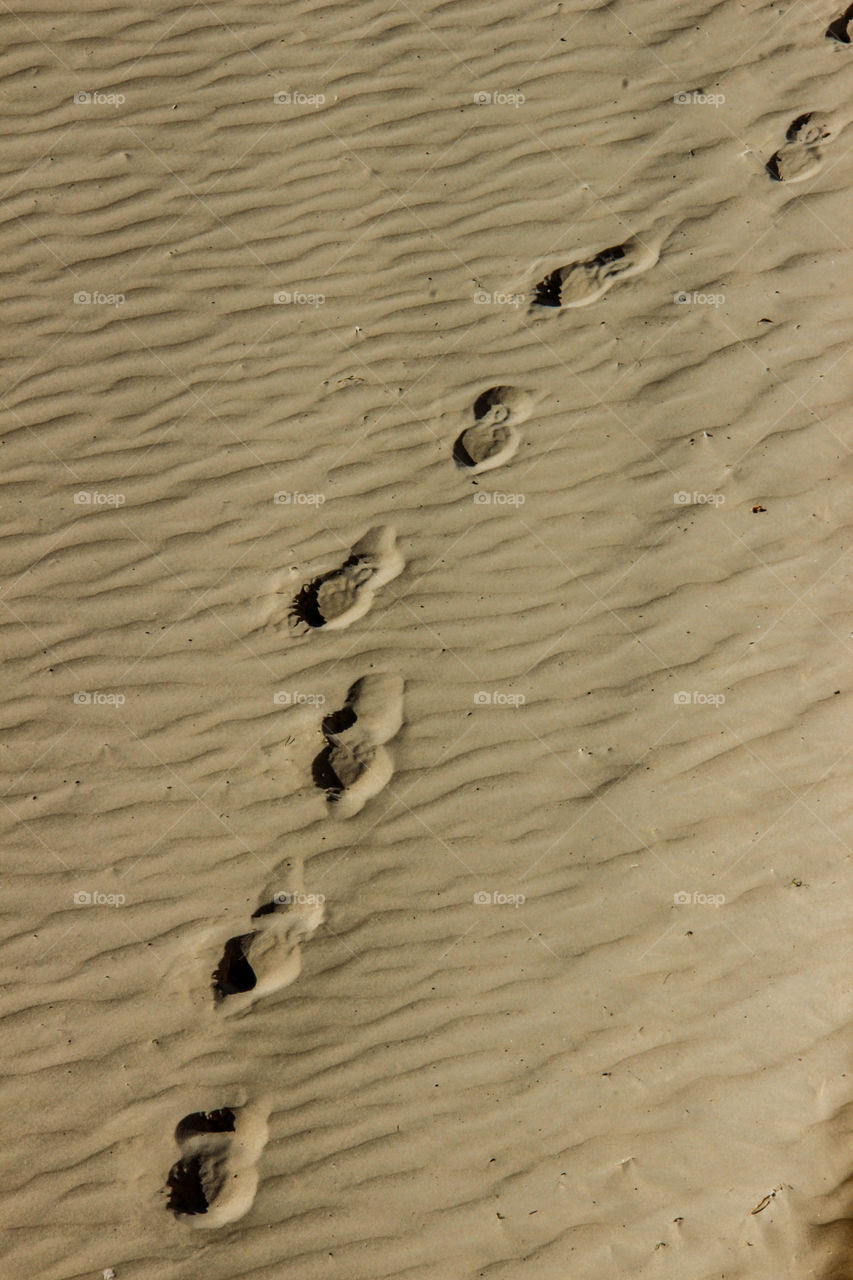 Fresh footprints on the beach in Alicante 