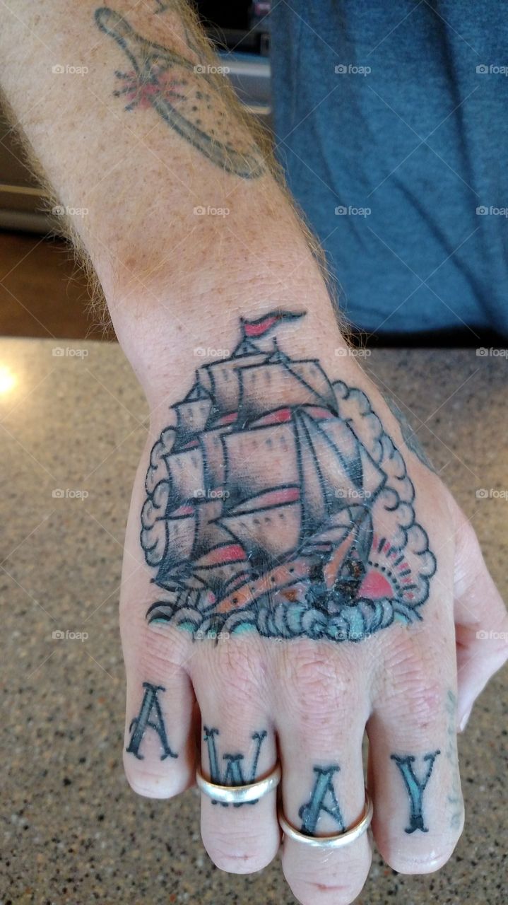 Sail boat and away on hand equals Sail Away