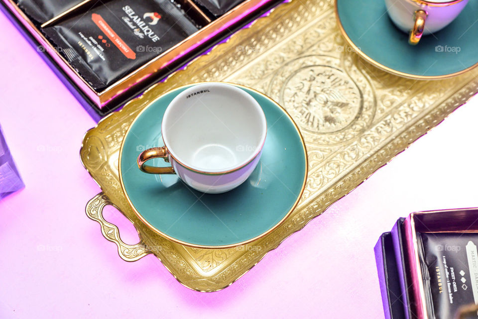 Beautiful tea cup on a golden tray