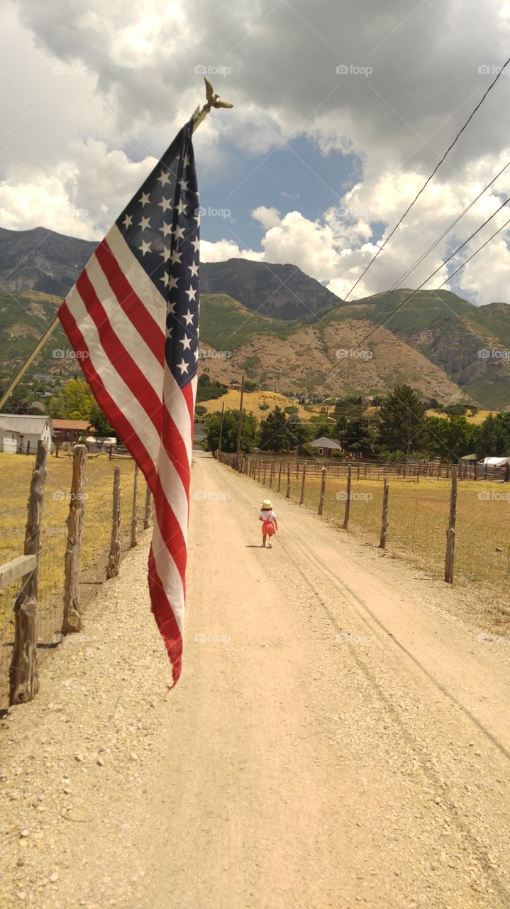 Little girl and Old Glory