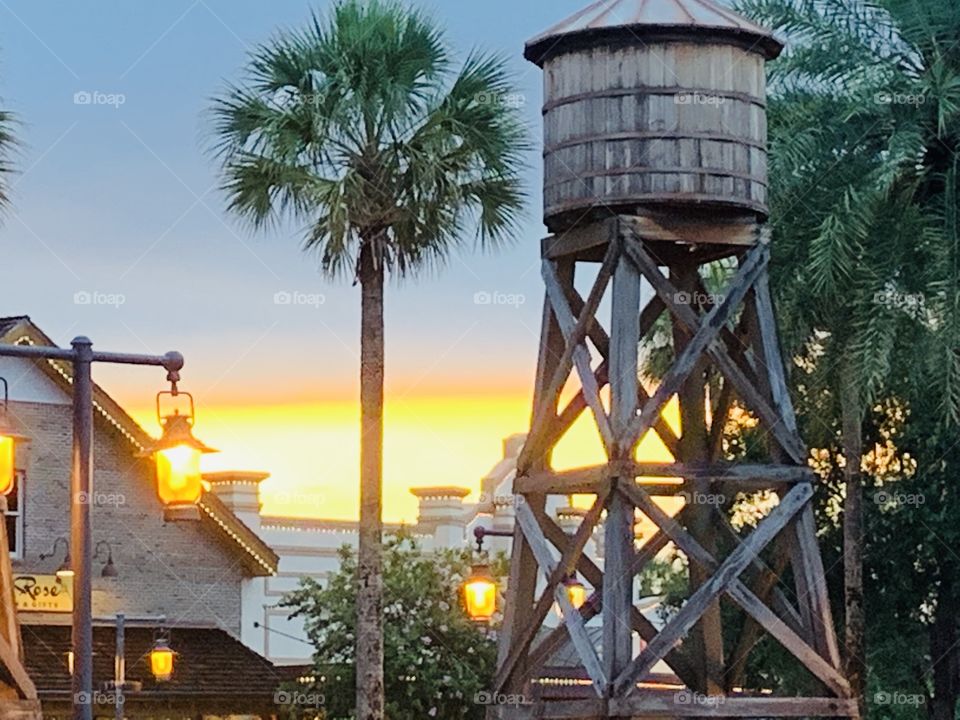 A sunset with a beautiful and majestic pop of color. That is painted against the sky. 