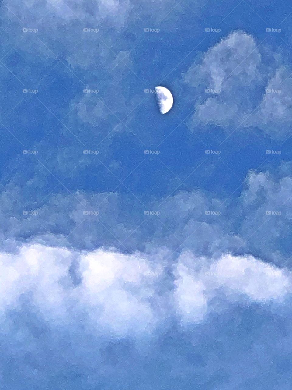 Moon in clouded sky