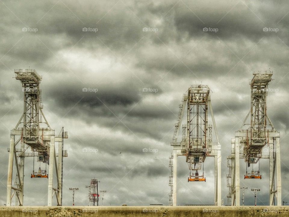 Maritime Cargo Cranes At A Sea Port. Iconic Cargo Cranes At The Port Of Oakland In Northern California
