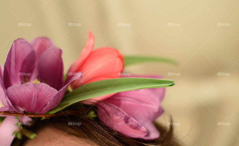 Wearing a flower crown getting ready for celebration closeup on crown in hair 