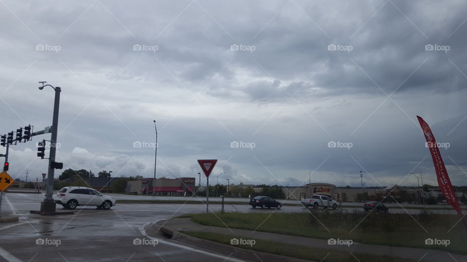 This is another shot of the storm clouds that were passing through our city. I was stopped at the red light and took this shot of the clouds. I got some businesses in the shot too.