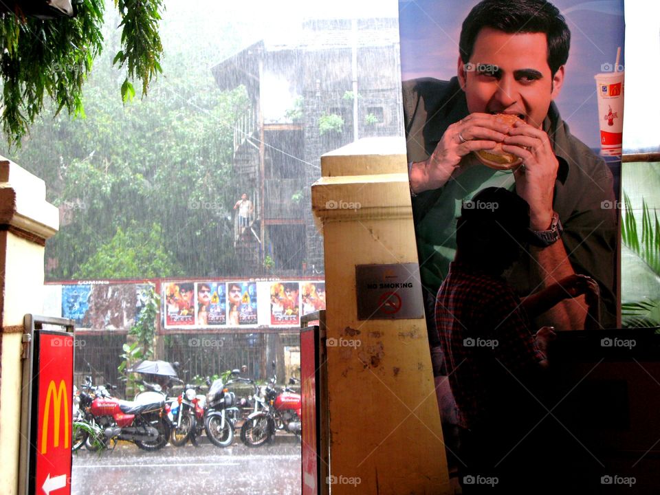 India: The monsoon season in Mumbai as seen by a refuge called Mc Donalds