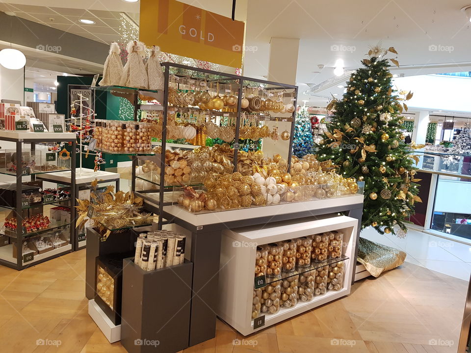 Gold themed Christmas decorations at Peter Jones Sloane square Chelsea King's road London