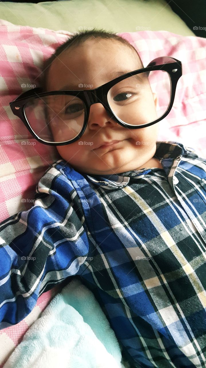 little baby smarty pants, looking so cute in his giant glasses.