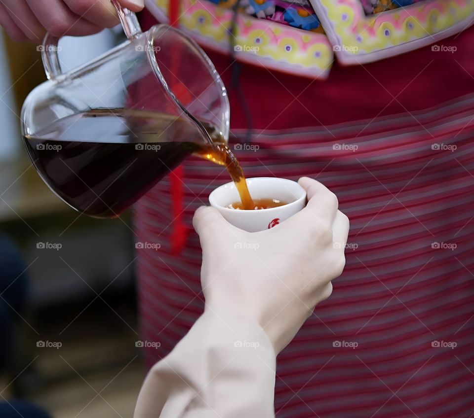 Drink freshly brewed tea served by locals