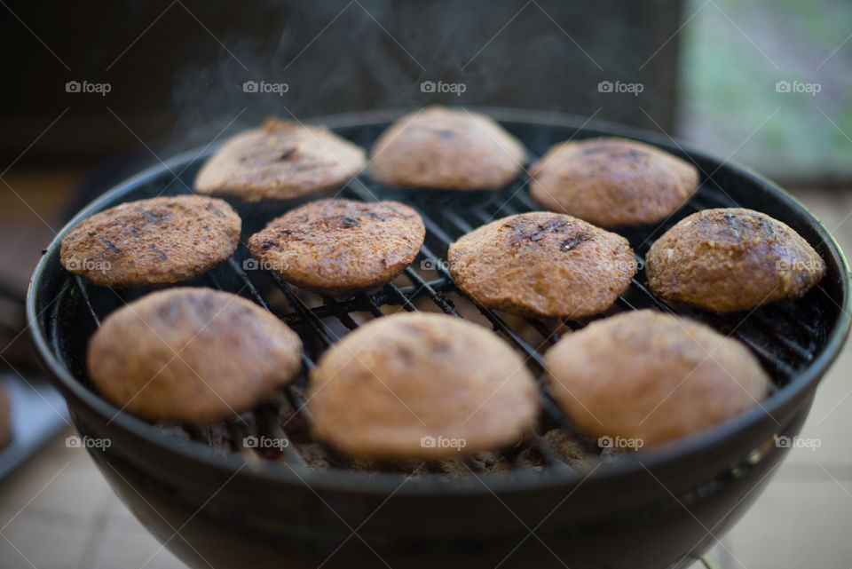 kibbeh bebbeh on the grill. no skewers. BBQ barbecue. beef meat.