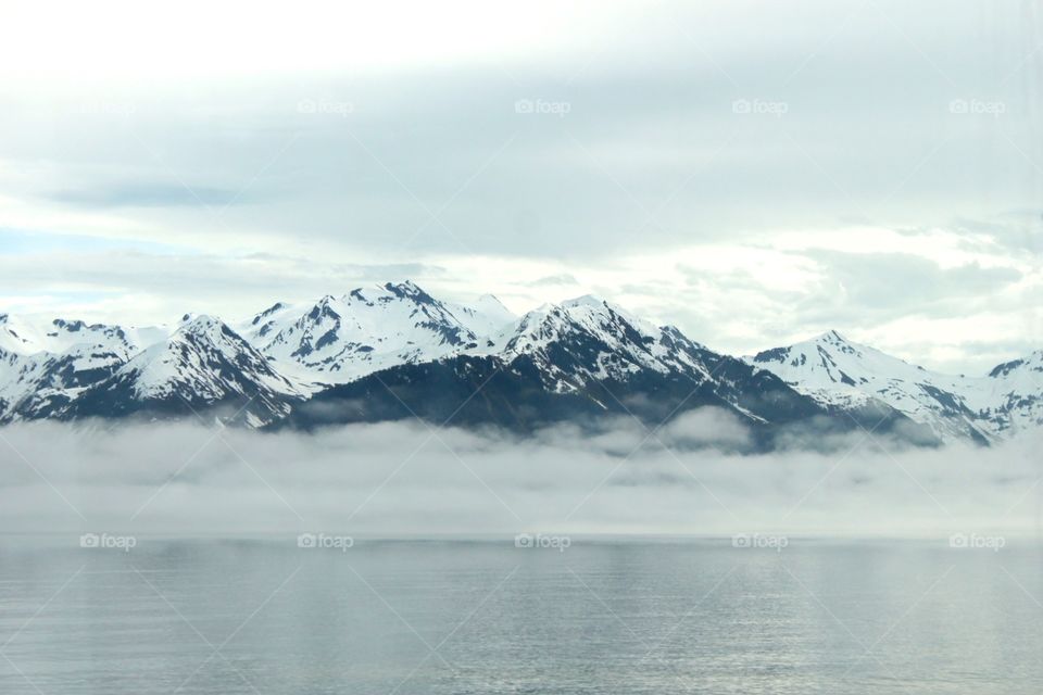 Snowy mountains in foggy weather