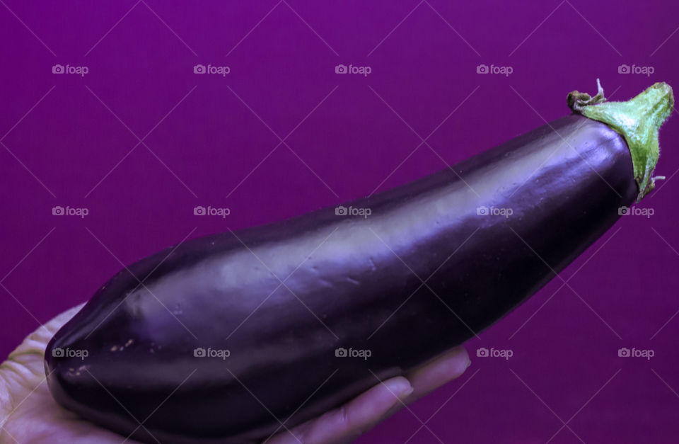 Eggplant on Violet background 