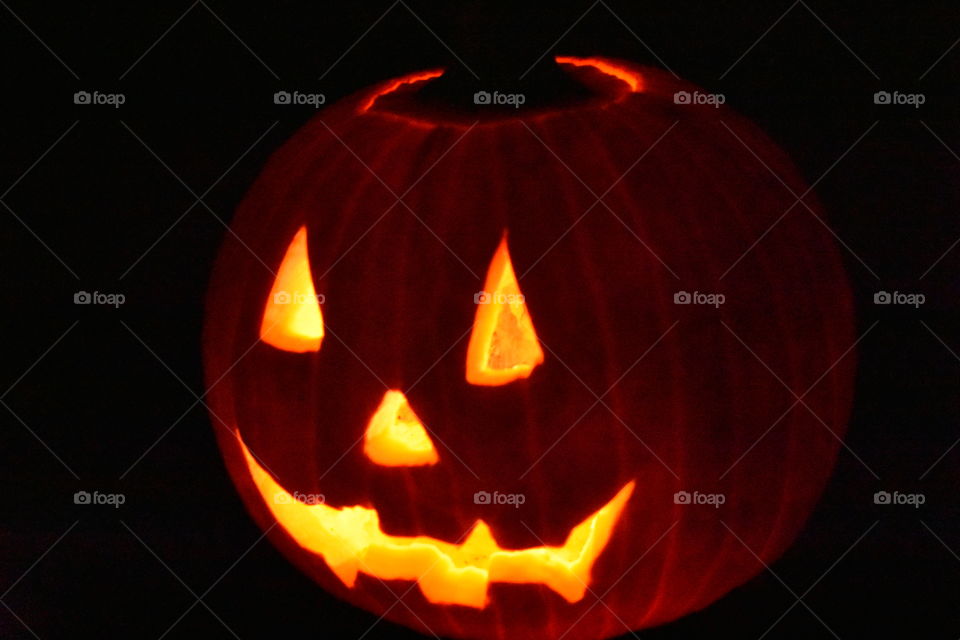 lit up halloween pumpkin at night