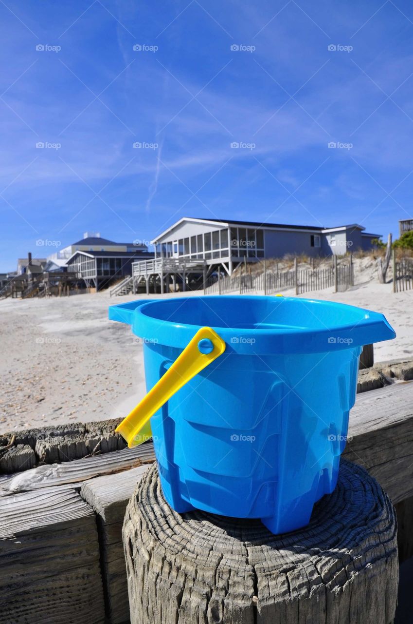 Beach bucket with rental homes.