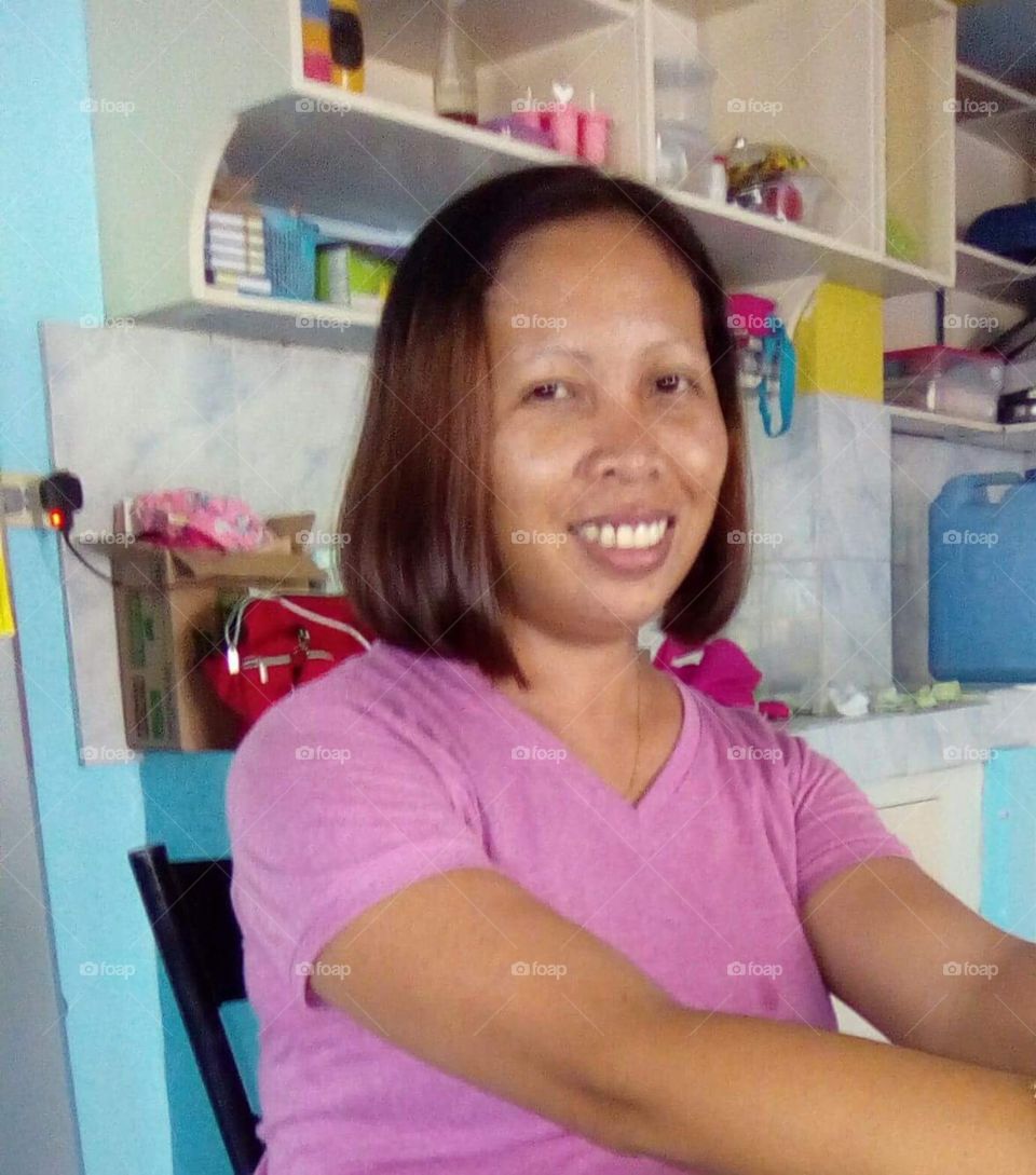 My partner looking radiant having gone for a shorter hair style out in the Philippines.