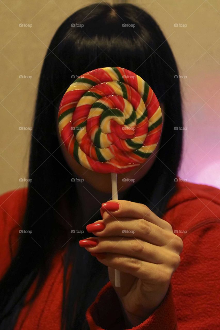 Candy in the hand of a girl