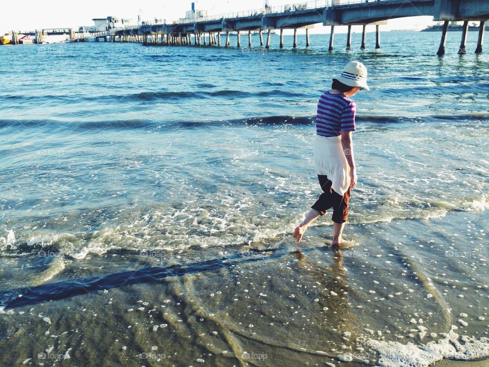 Woman walking on beach