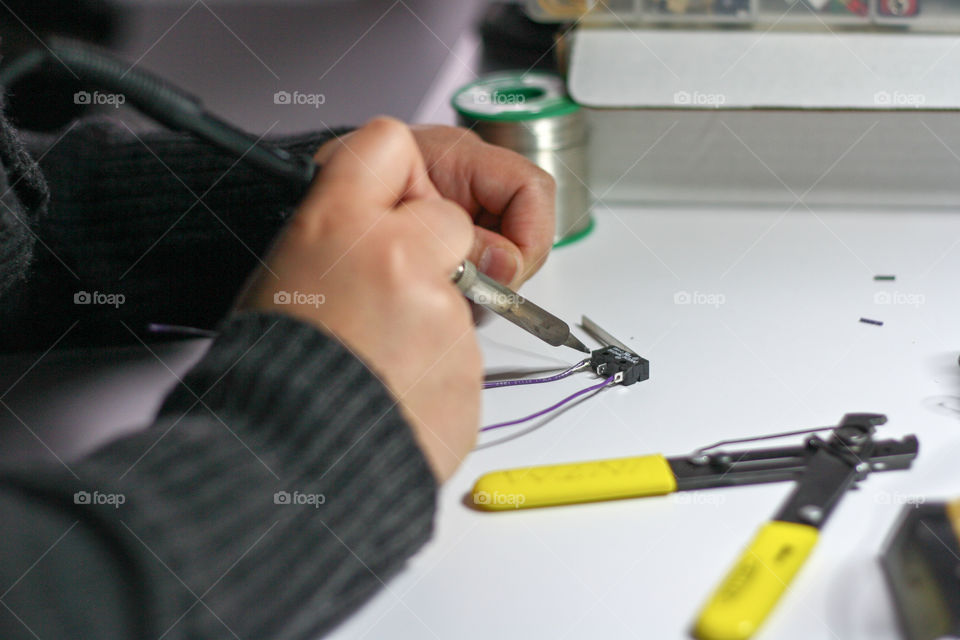 Hands soldering arduino components
