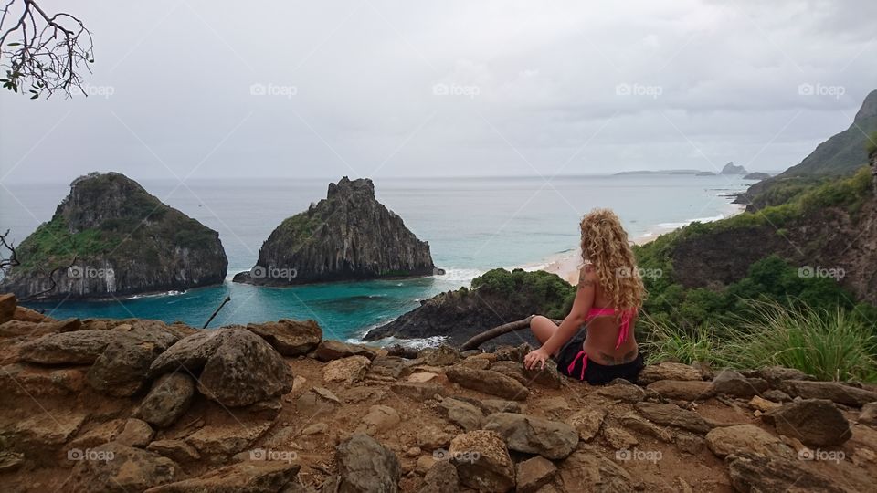 Woman looking at cliffs 