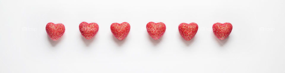 Red hearts on a white background. Valentine's Day.