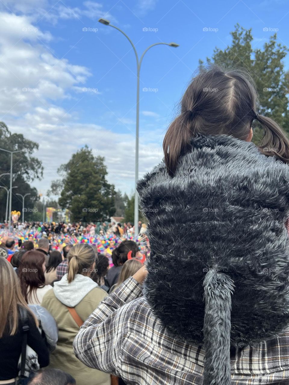 Father and day watching carnival 