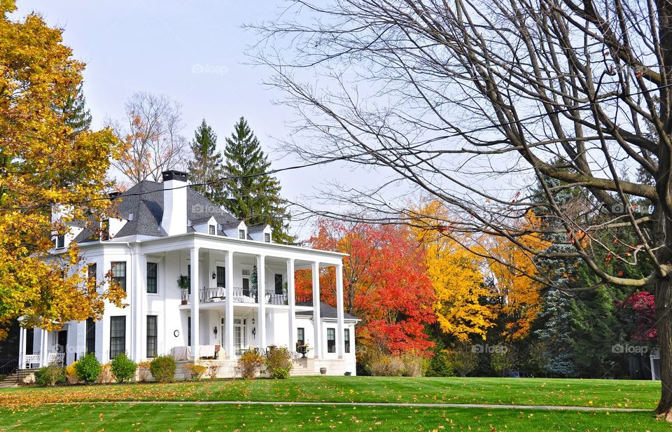 Neo Classic Homes of Saratoga. This gorgeous Neo Classic style home during the Fall at Saratoga. Front wrap around porch and perfectly manicured lawn. 