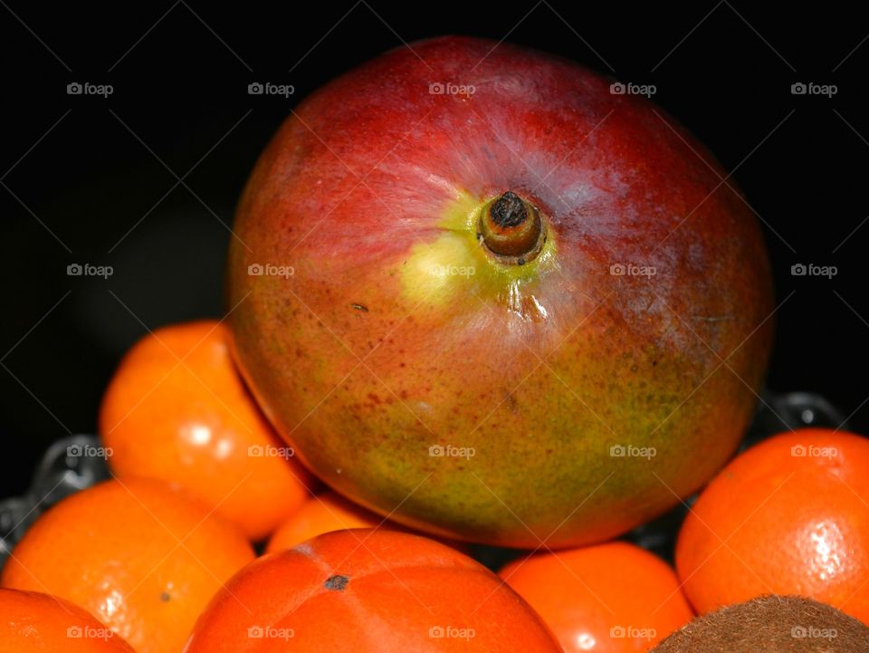 fresh tropics mango and fruits black  background