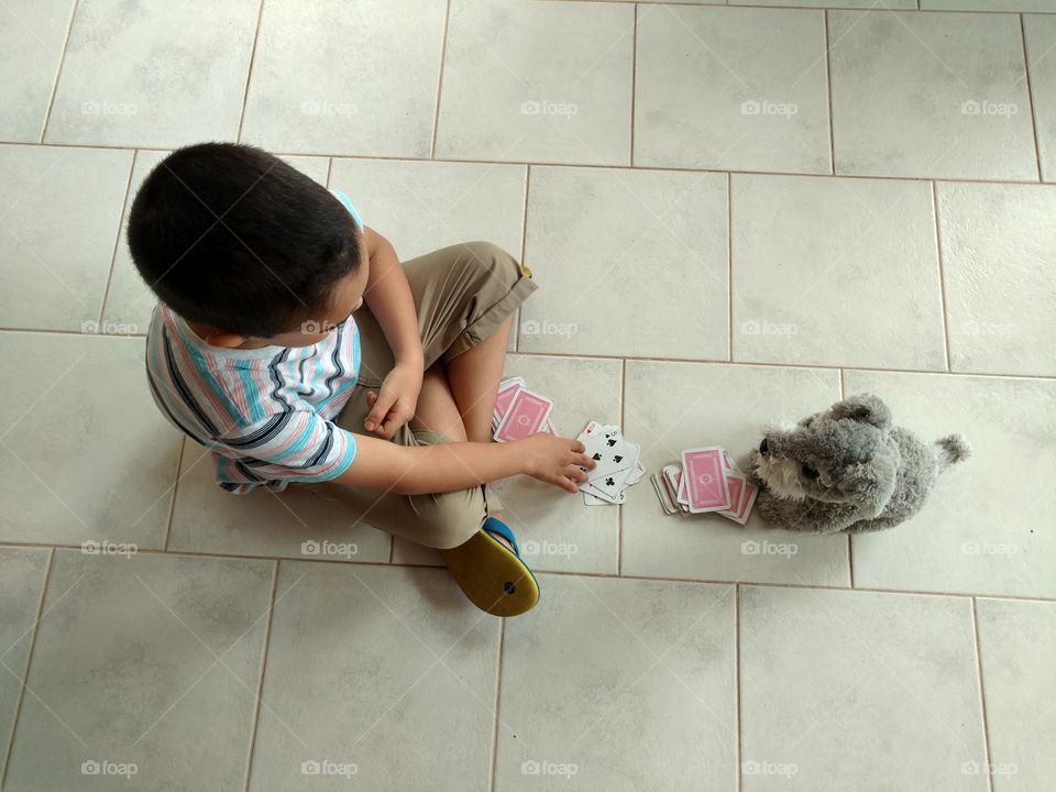 playing with his favourite stuffed animal