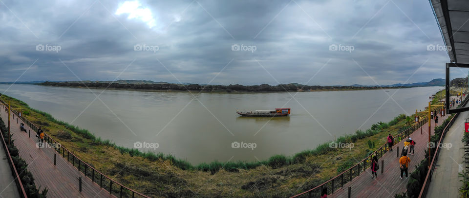 Tourists on corridor and boat on the Mekong River at Chiang Khan, Loei in Thailand December 30, 2018.