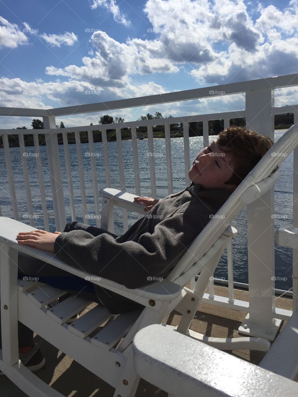 Lazy Days by the water boy and chair