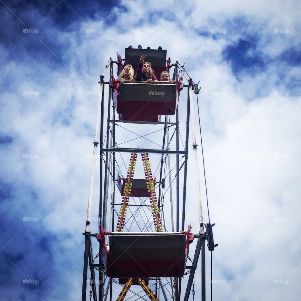 Hey up there!. Looking up at my cousin and her friends on the Ferris wheel at the city fair in Bangor Ireland 