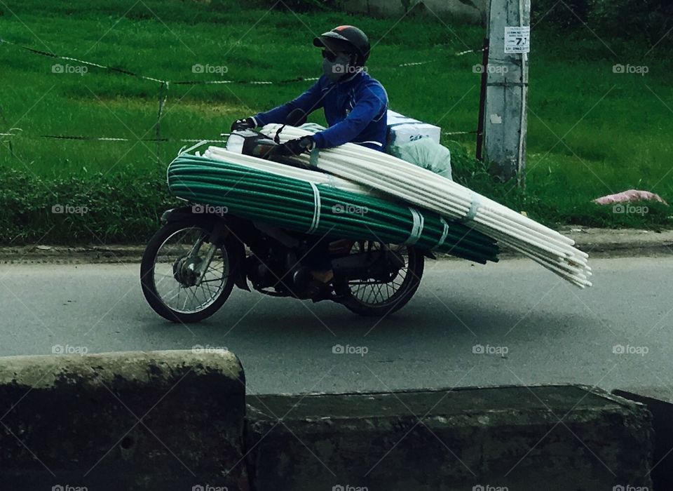 Loaded delivery on a motorbike 