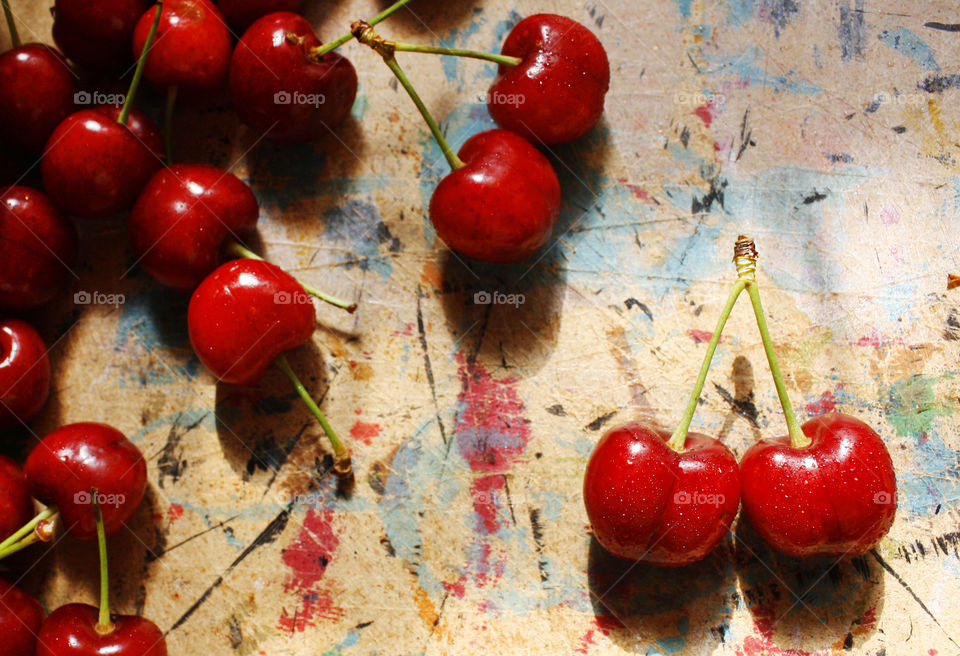 Cherries on colorful background