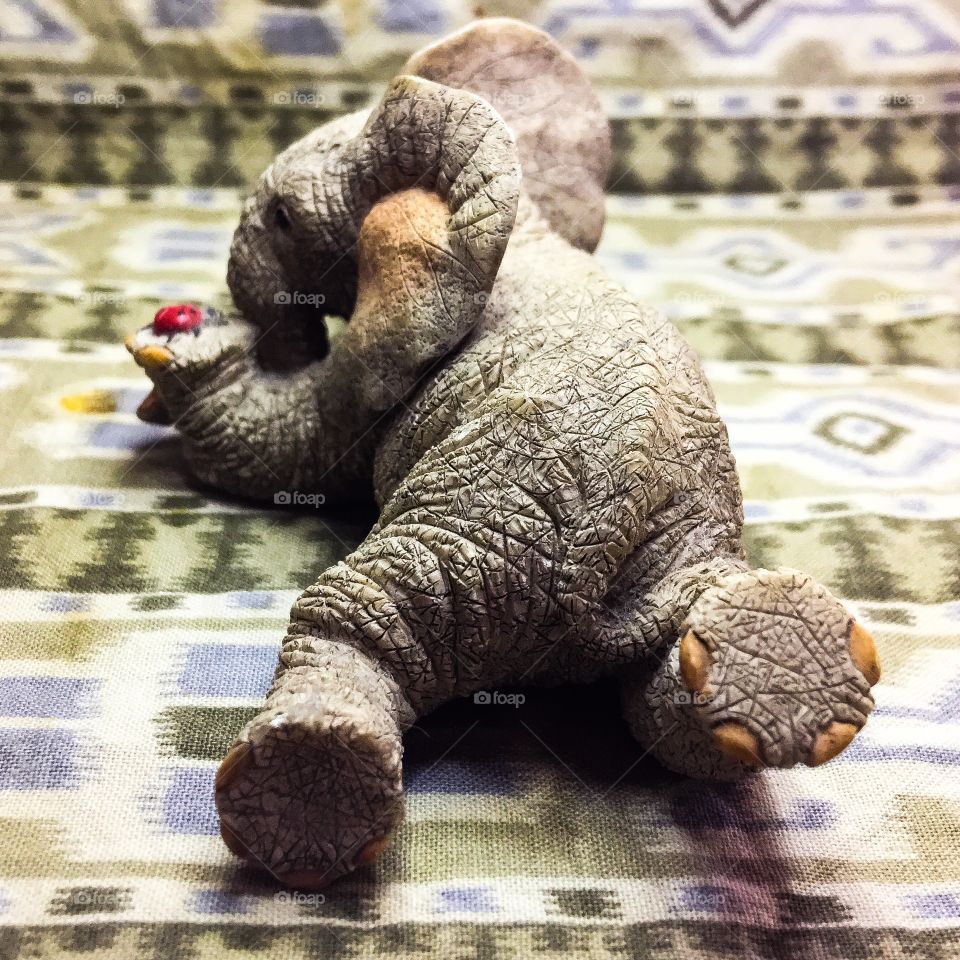 A 69¢ figure of an elephant with hanging out with his friend ladybug.