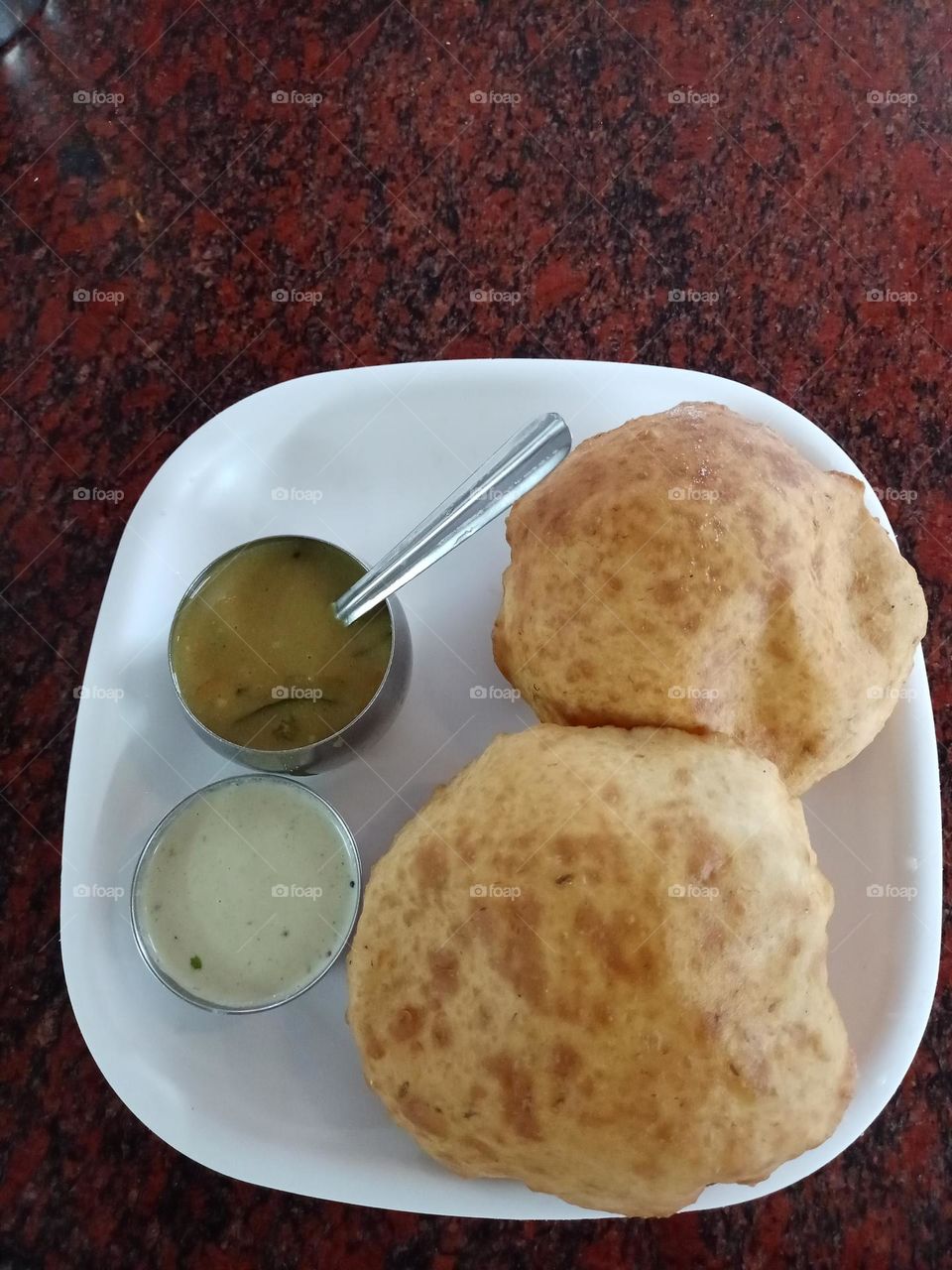Enjoying morning tea with Indian dishe Puri bhaji with coconut chetny it's different types of test amazing