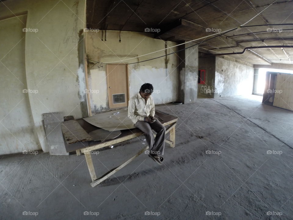 Texting . Smiling while talking with his wife
New Delhi - India 