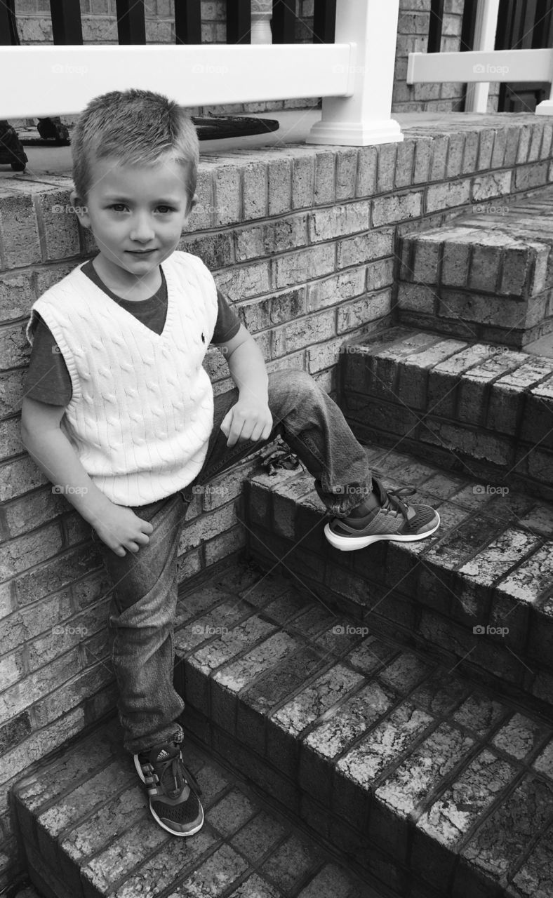 Child on brick stairs