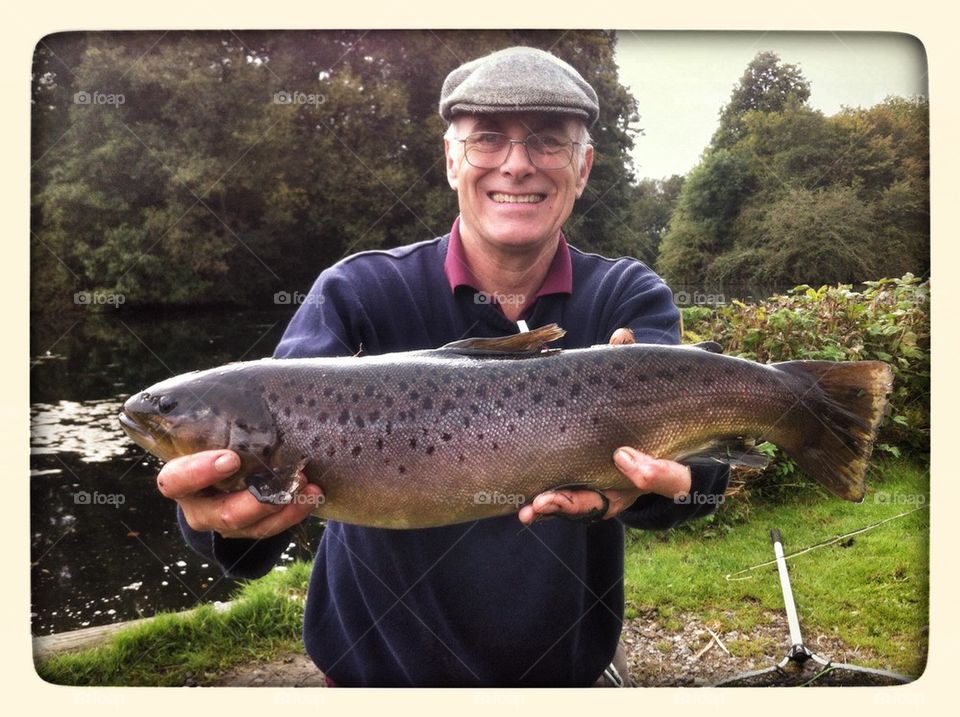 Fisherman with a trout