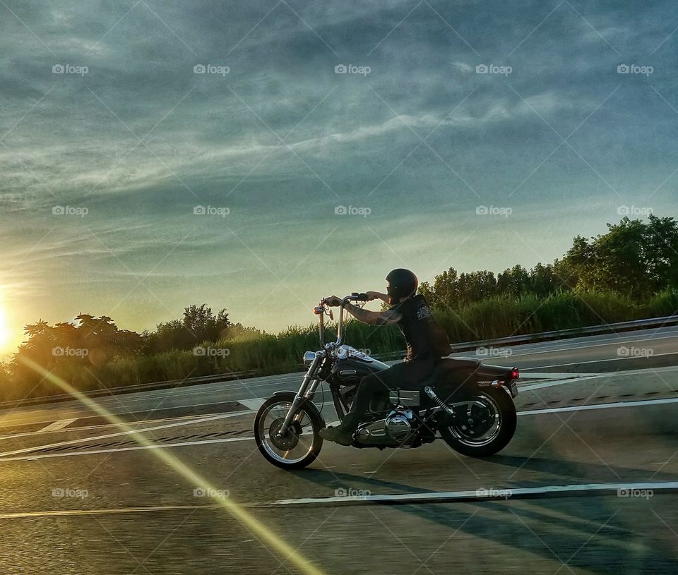 Sunrise
beautiful Sunray seen on the road and biker captured....