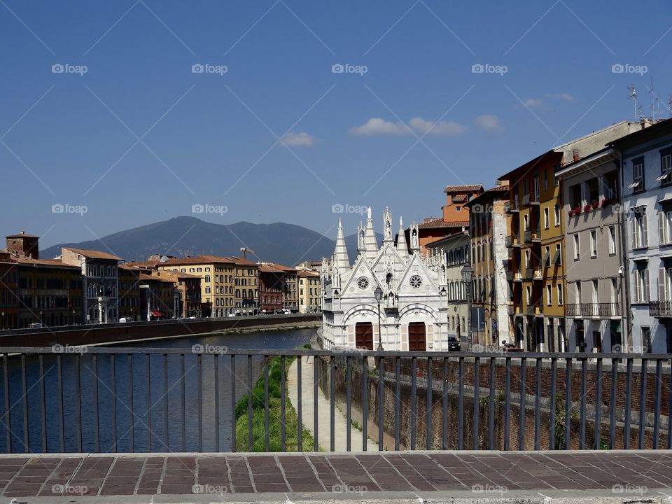 Beautiful architecture and scenery, Pisa Italy ... Pisa is not just the leaning tower . This is beautiful heavenly Pisa . Breathtaking, from the architecture of the buildings to the mountains, blue sky and river ... picture perfect :)