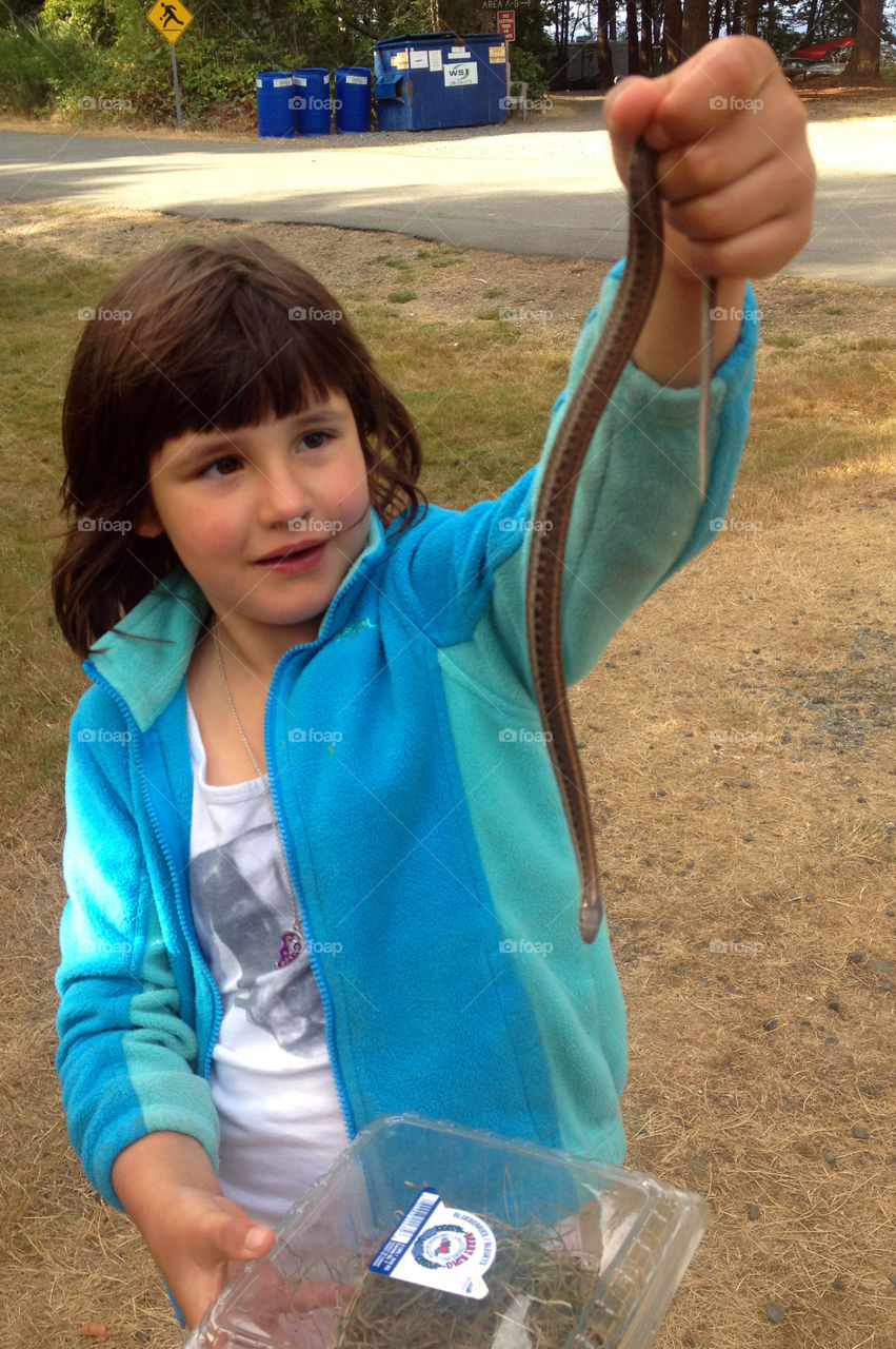 Summertime Is about camping & exploring nature. My fearless girl caught a garter snake & wanted to add him to our zoo! Luckily, we convinced her he would miss his family too much & she let him go! 🐍