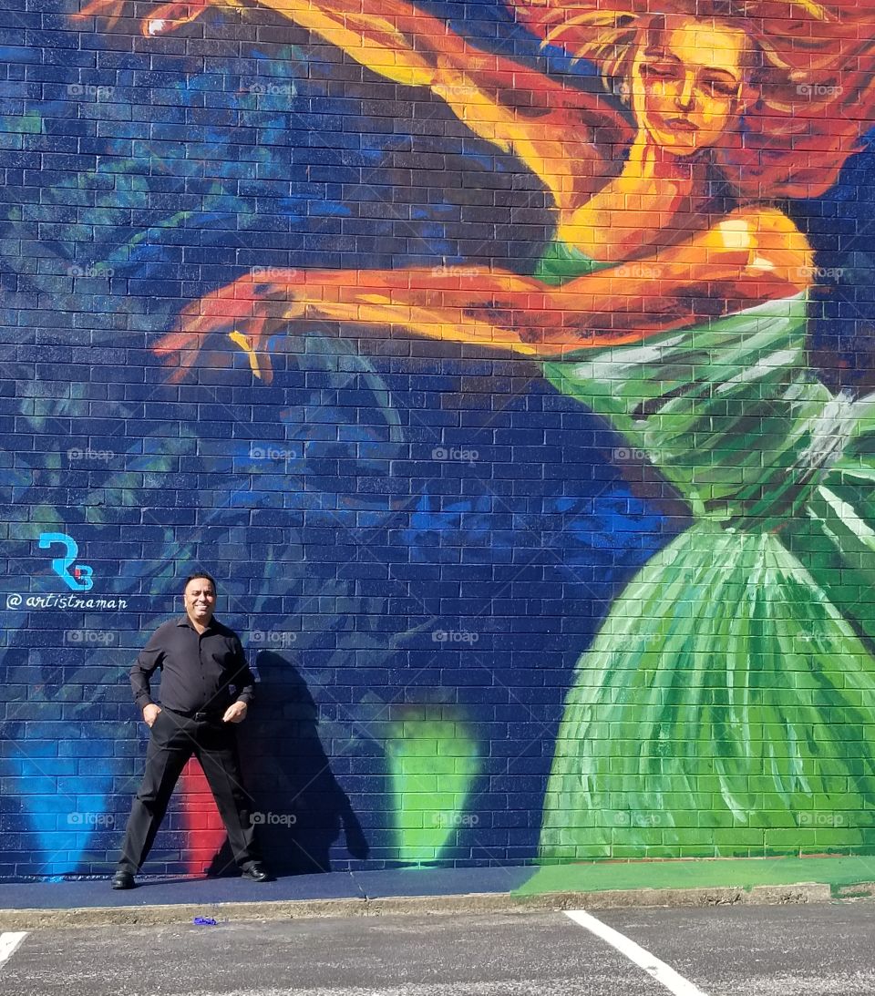 Mural at dance studio of woman dancing with man standing under her