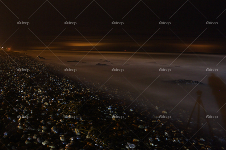 beach stones night sea by leonbritton123