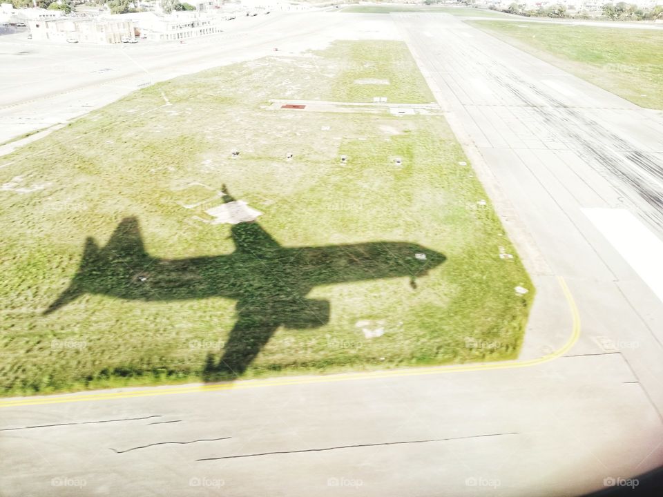 Airplane shadow on the landing strip